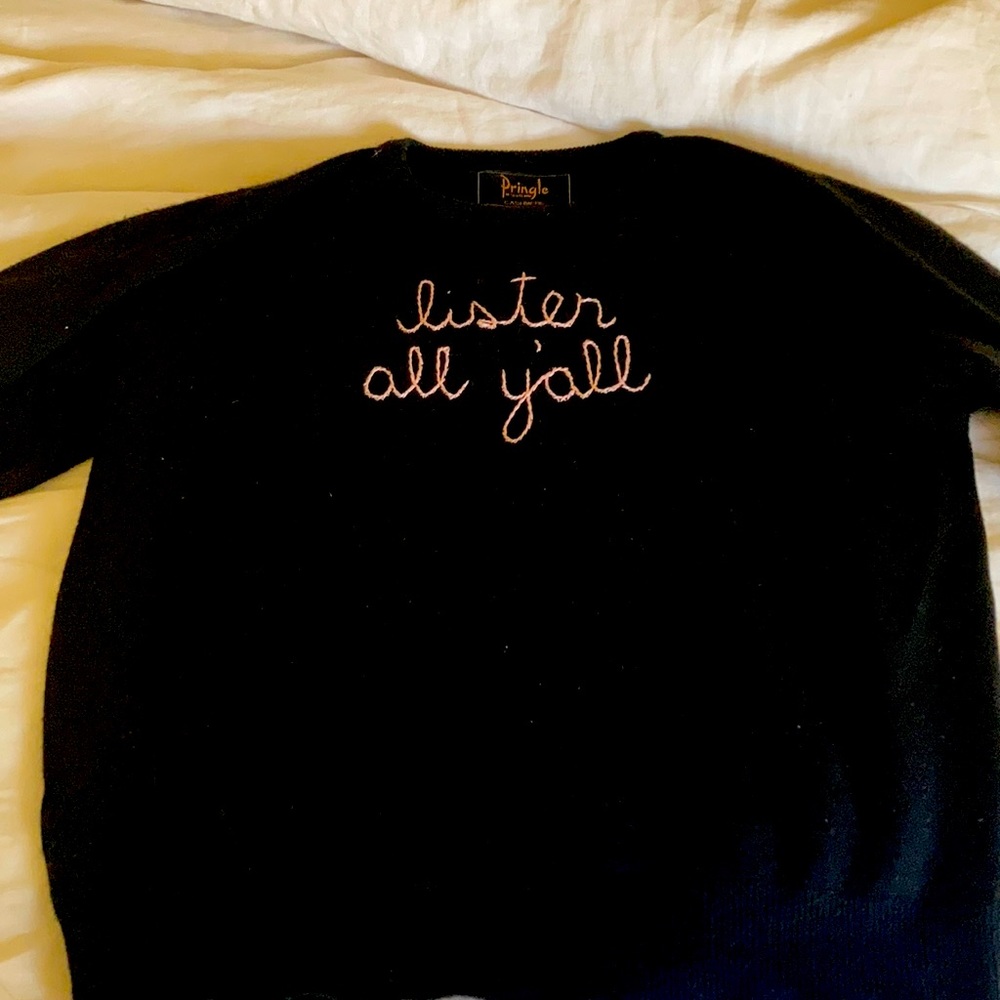 Hand embroidered cashmere sweater.